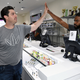 Essence Vegas CEO Armen Yemenidjian (left) high-fives employees at Essence Vegas Cannabis Dispensary as they get ready for the midnight start of recreational marijuana sales on June 30, 2017, in Las Vegas. (Ethan Miller/Getty Images)